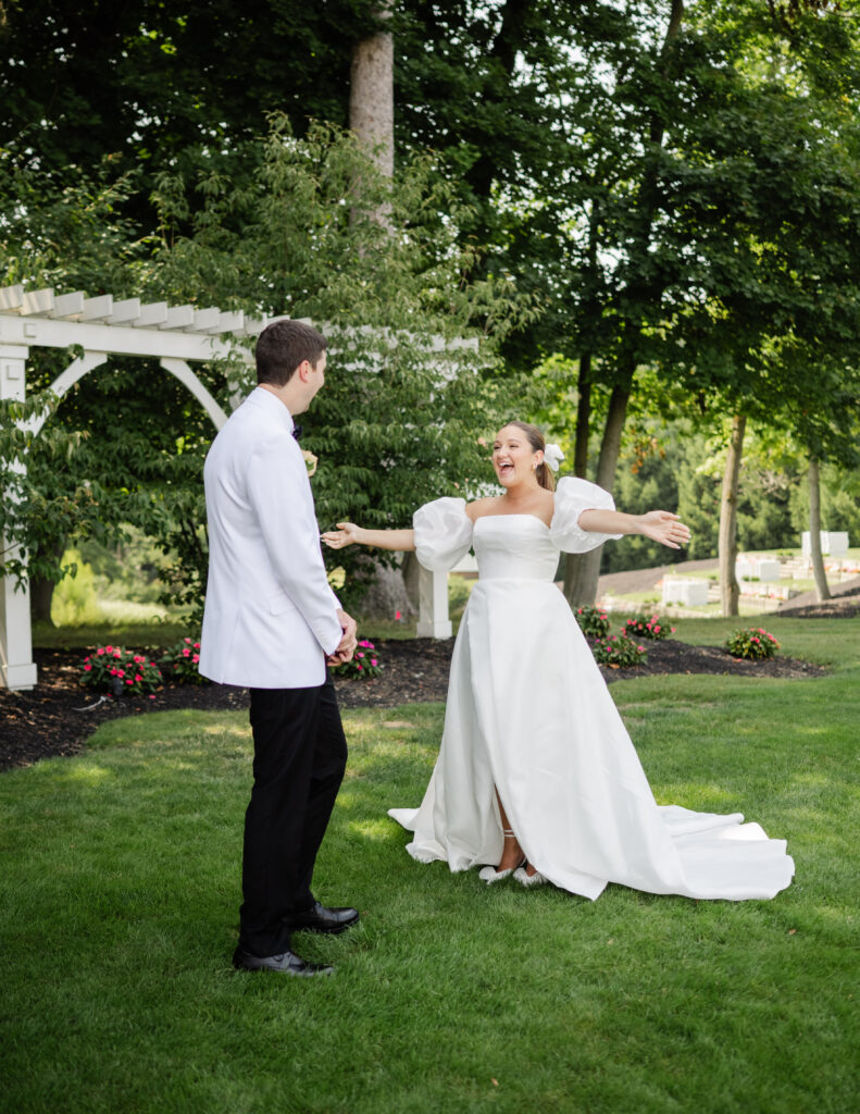 first look between bride and groom at avanti mansion garden venue