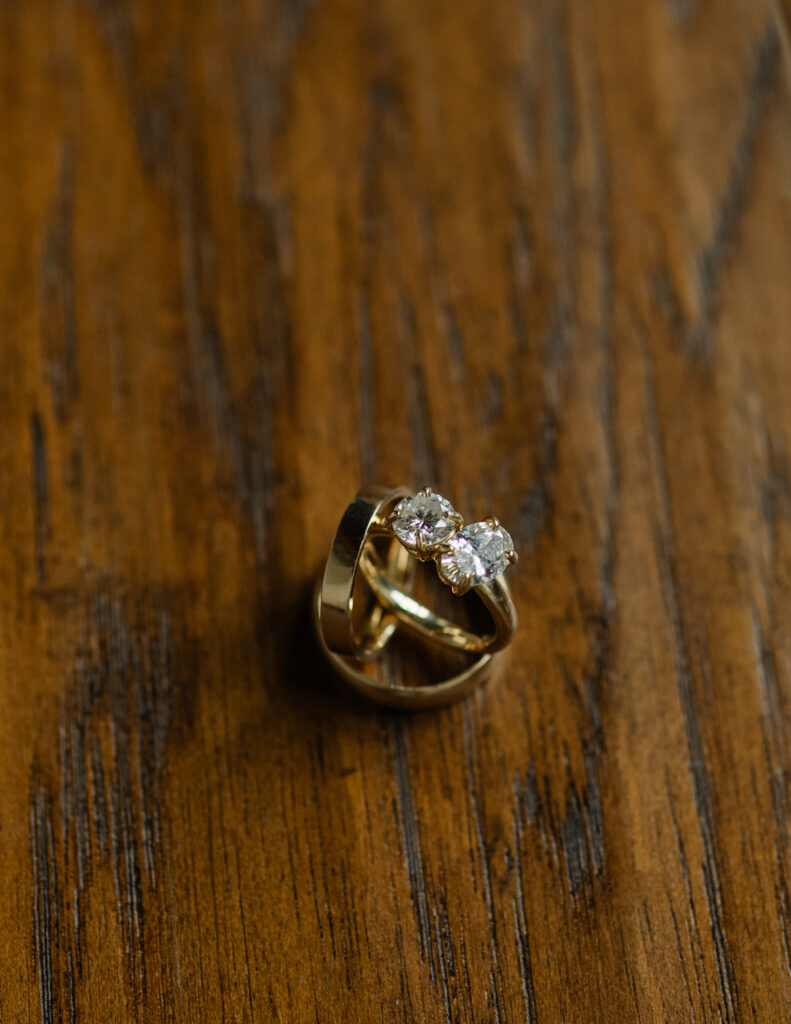 close up photo of rings on wedding day
