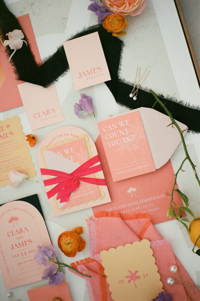 a 35mm film photo of a bright and vibrant palm springs elopement invitation suite