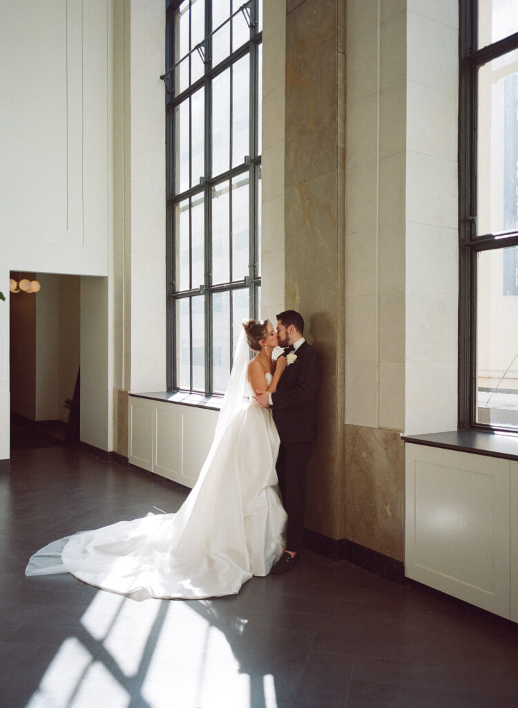 A wedding photo captured on 120mm film featuring a bride and groom with a timeless, grainy aesthetic.