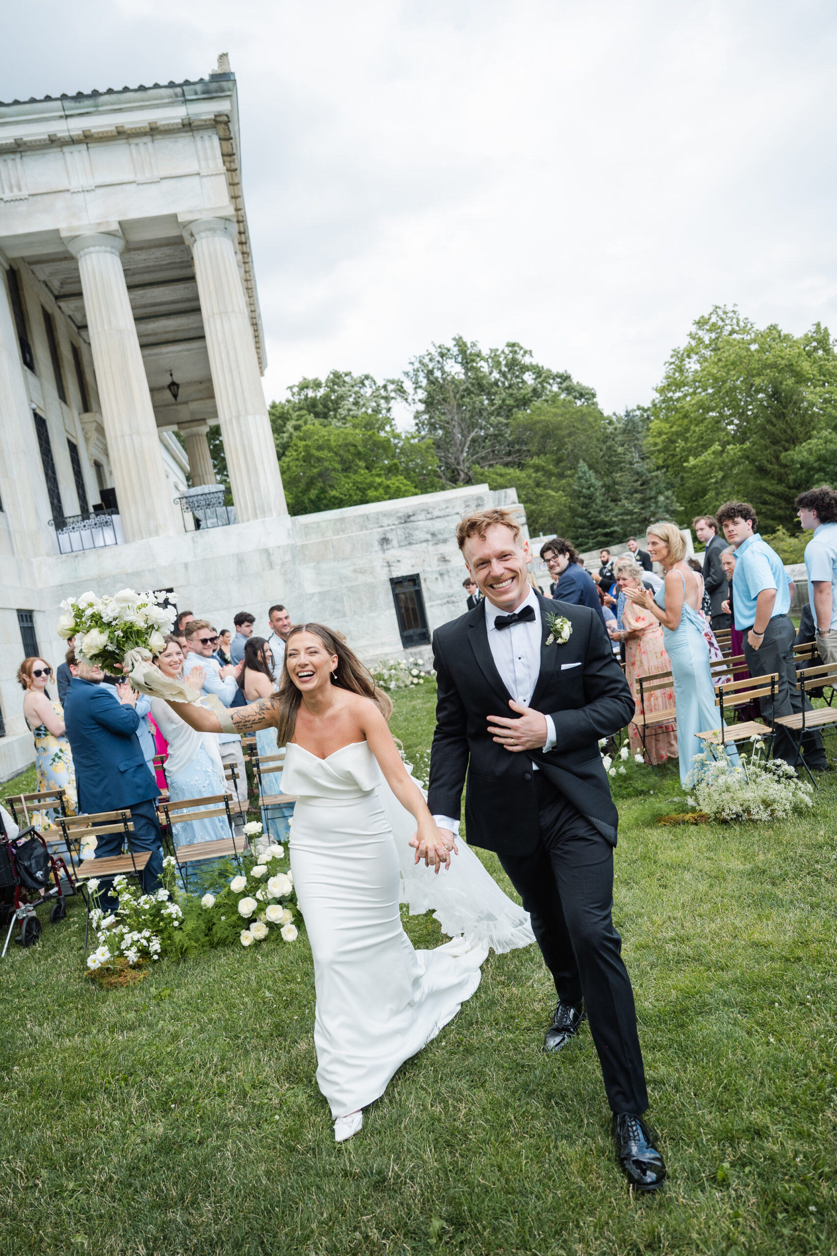Bride and groom celebrate after their ceremony at Buffalo History Museum.