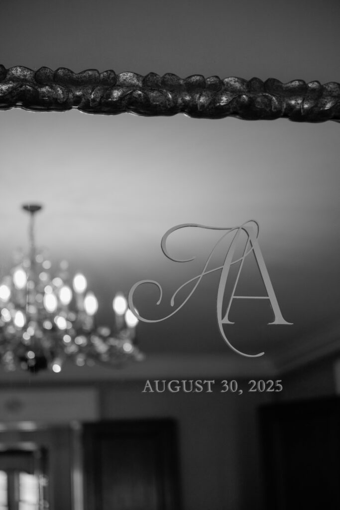 Personalized monogram details on a mirror within the mansion.