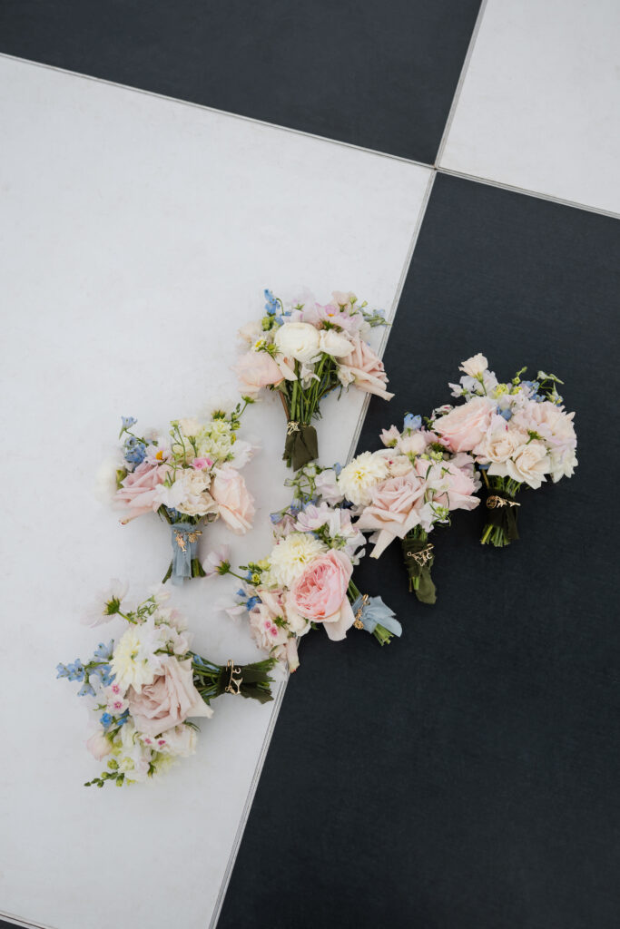 Bridesmaids bouquets with charm pins by Stacked by Em at The Mansion at Knox Farm wedding.