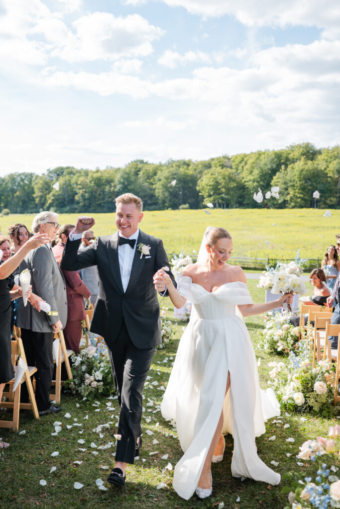Bride and groom walking back down the aisle at The Mansion at Knox Farm wedding in East Aurora, NY