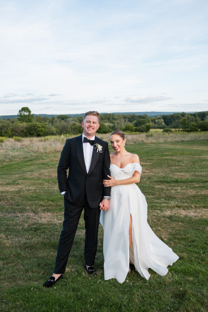 Bride’s Madi Lane wedding gown from Heart to Heart Bridal twirling moment during golden hour.