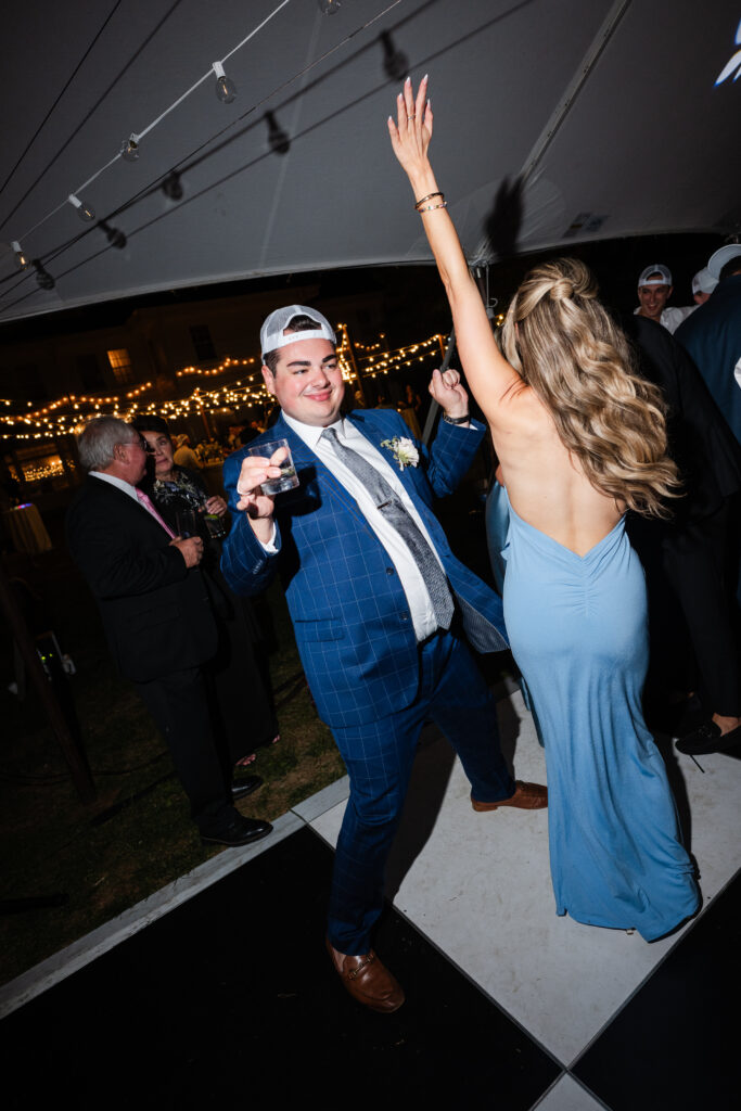 Guests dancing under the sailcloth tent at The Mansion at Knox Farm during summer wedding.