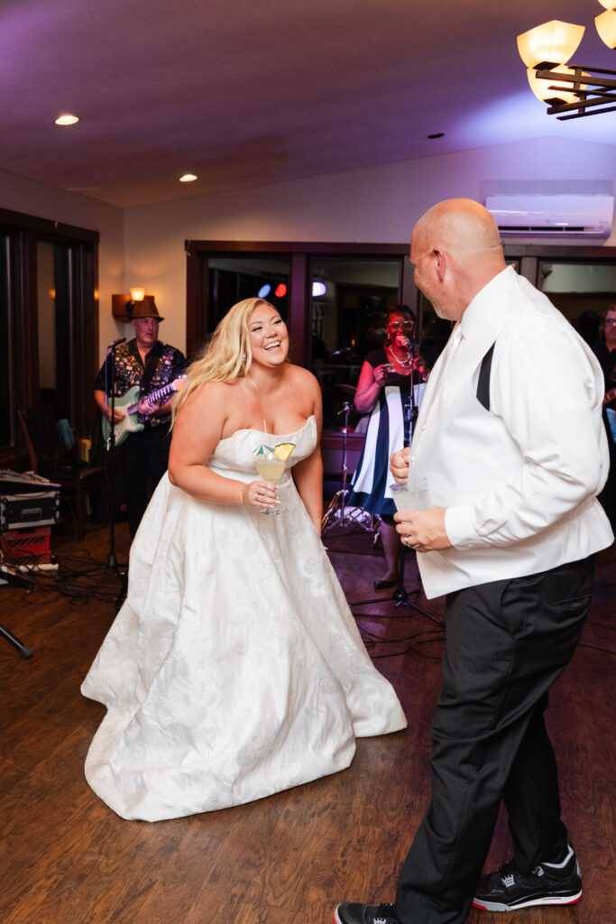 Bride and groom dancing with live band