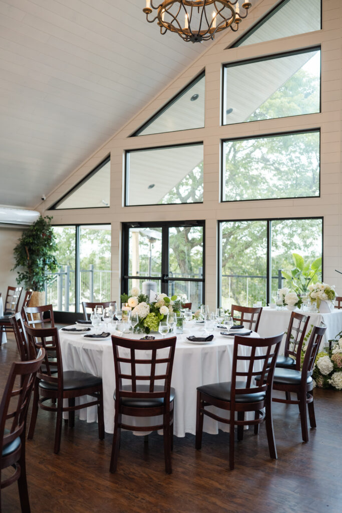Reception space at Clifton Springs Country Club decorated with greenery