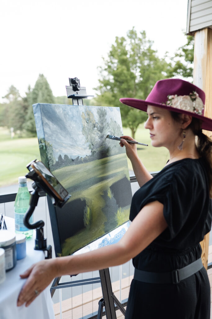 corinne yancone live painting during cocktail hour
