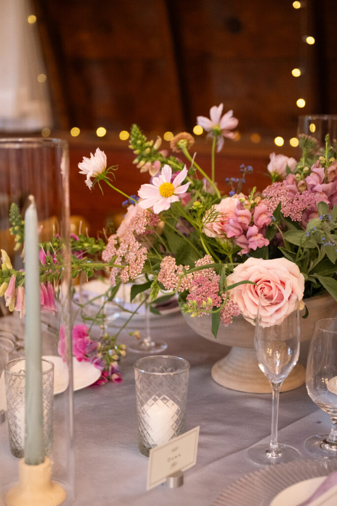 Colorful wedding floral arrangement in vibrant pinks and blues