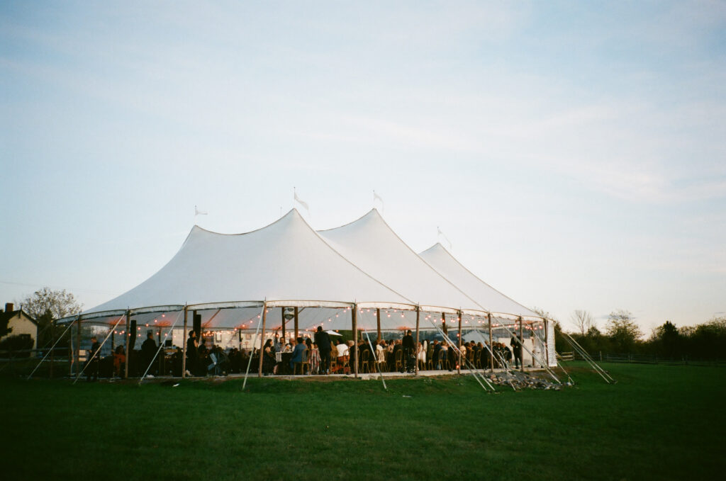 35mm film image of reception tent during sunset