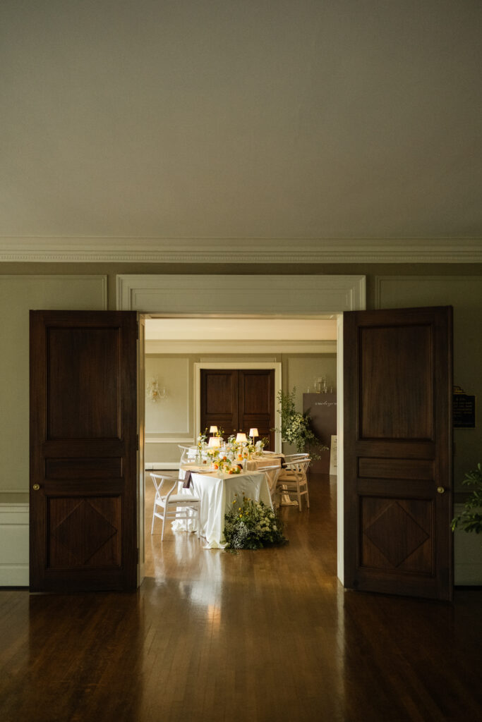 view of dinner table through venue rooms