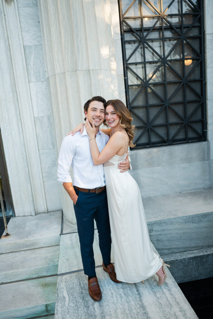 engagement photos during sunset at buffalo history museum