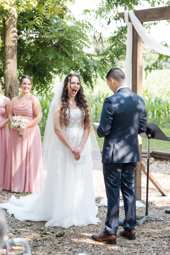 couple exchanging vows at intimate at the hillcrest estate in new york