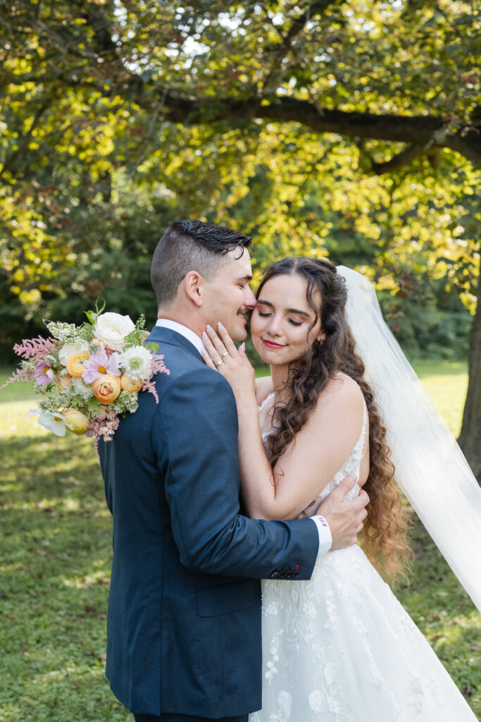 flirty wedding portraits between bride and groom during sunset on their wedding day