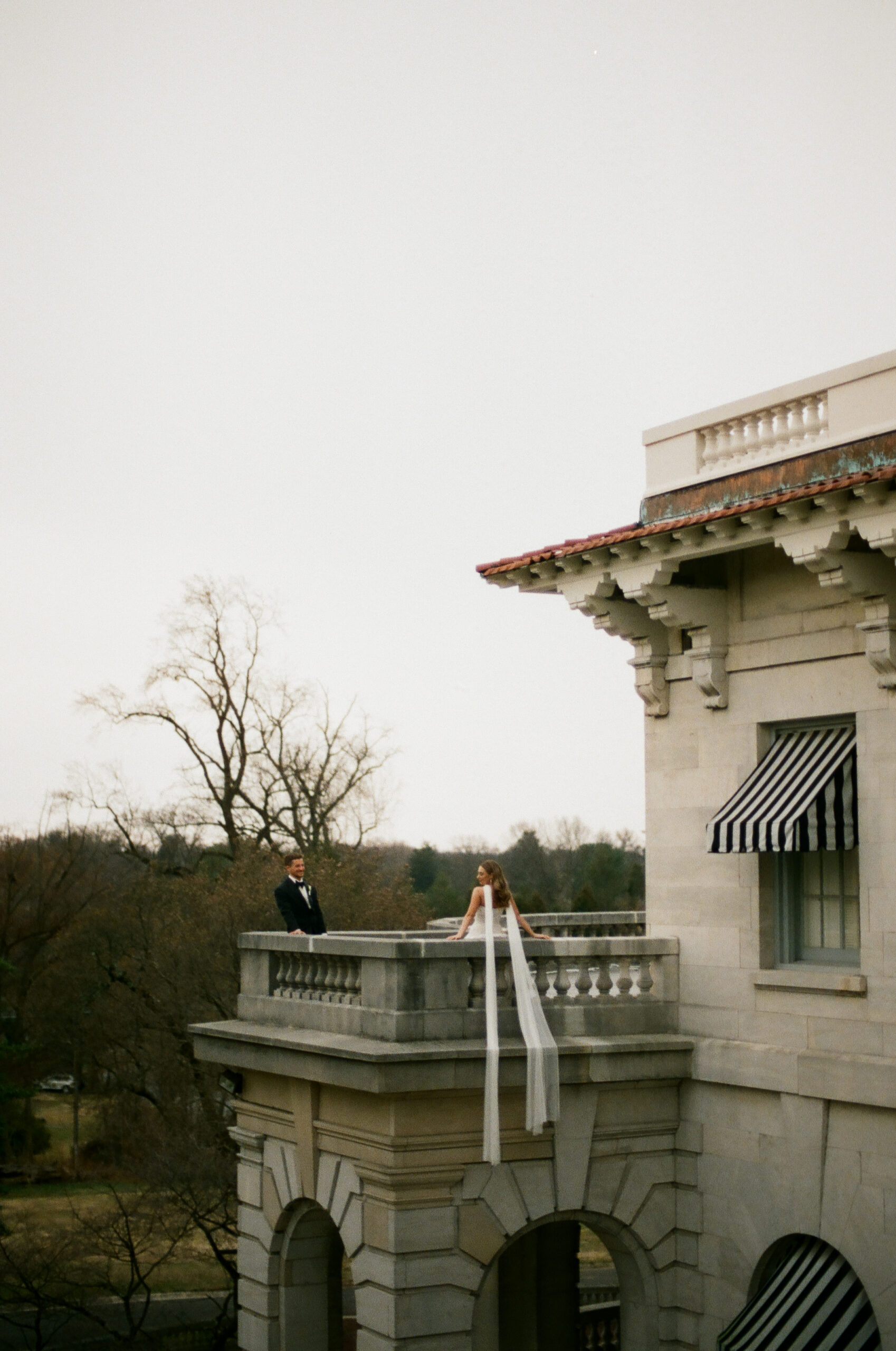 elegant wide angle wedding portrait of bride and groom on their wedding day