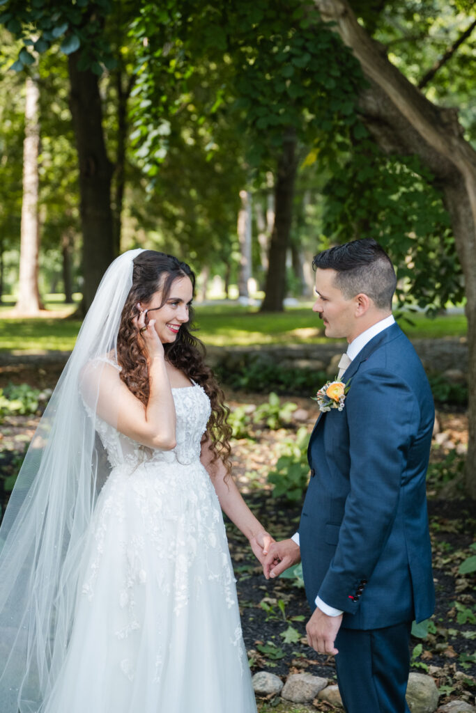 Wedding photographer helping couple feel natural during portraits